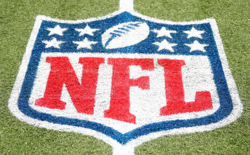 © Reuters. FILE PHOTO: Aug 1, 2024; Canton, Ohio, USA; General view of the NFL shield logo on the field at the Tom Benson Hall of Fame Stadium site of the Professional Football Hall of Fame game and induction ceremonies. Mandatory Credit: Charles LeClaire-USA TODAY Sports/FIle Photo